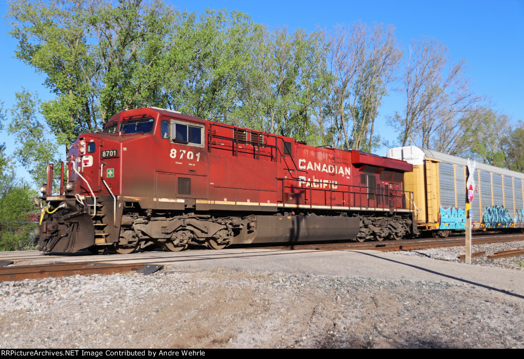CP 8701's bright red paint is still apparent under years of weathering, dust and oil streaks